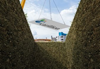 Carillion being lowered into a grave